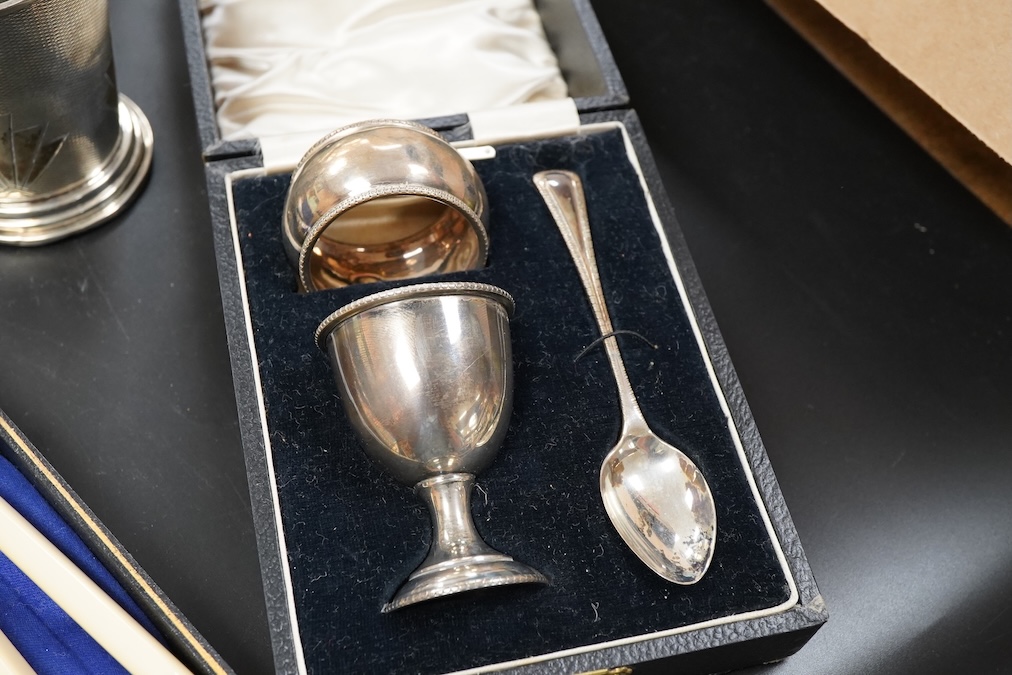 A silver christening mug, Birmingham, together with three cased sets, silver rimmed cut glass bowl, plated cocktail shaker etc